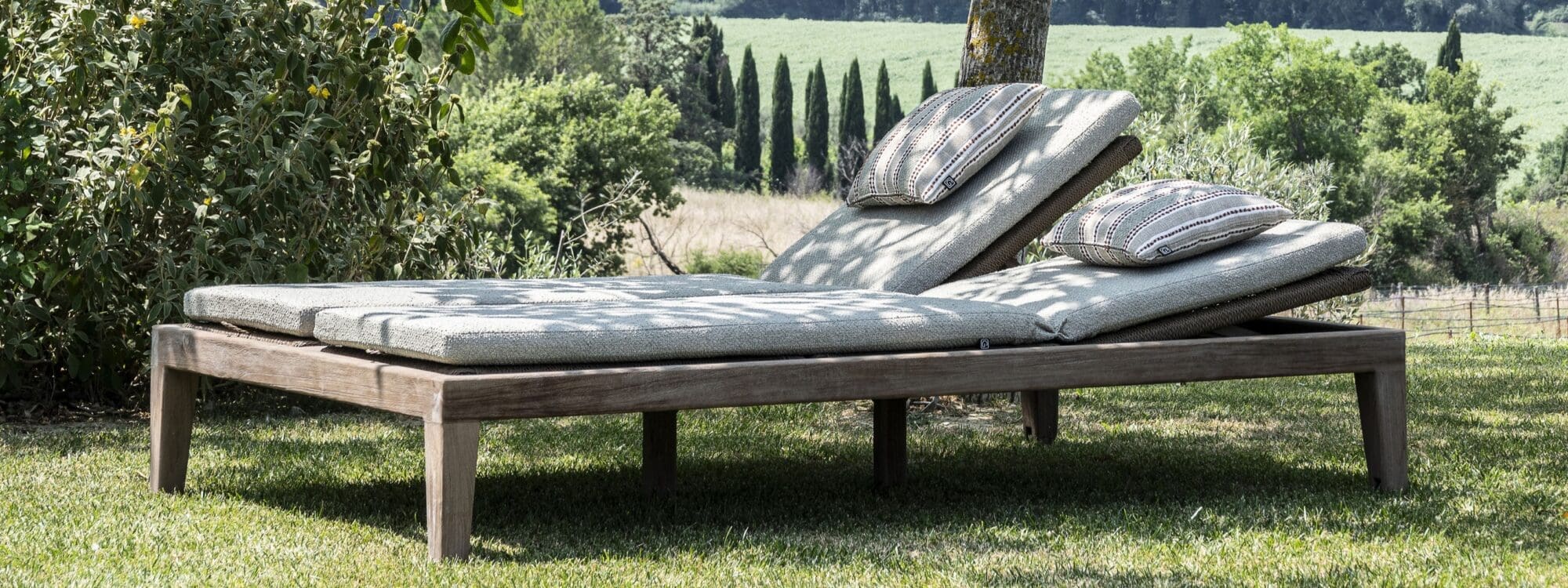 Image of Gommaire Double Sunlounger Lisa with cushions on green grass lawn