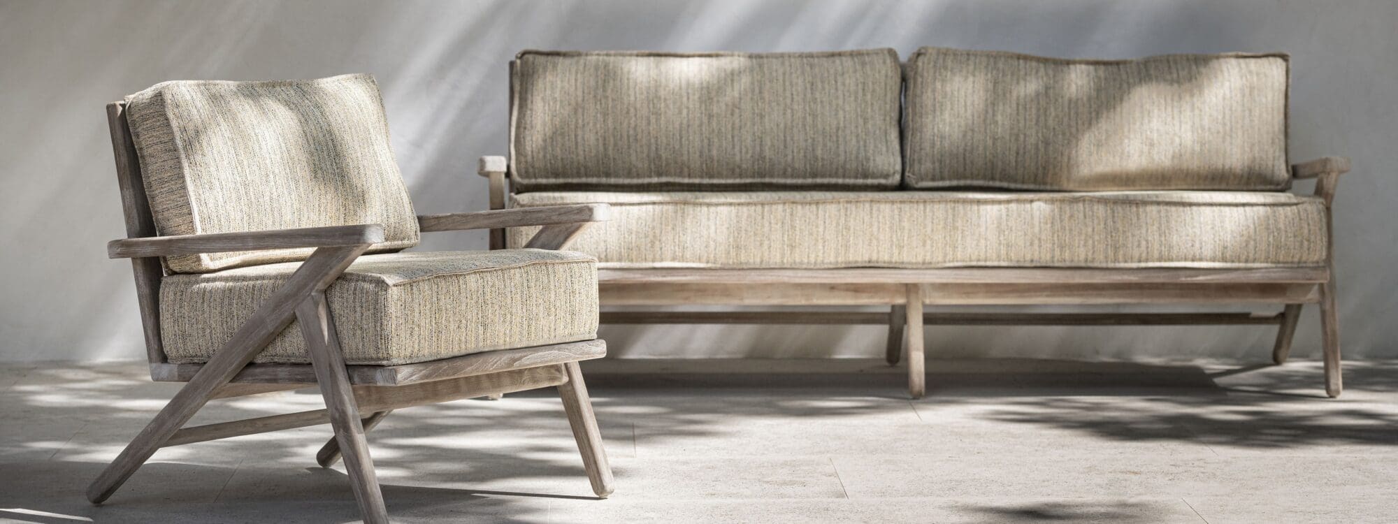 Image of Gommaire Alabama luxury teak lounge furniture in dappled sunlight