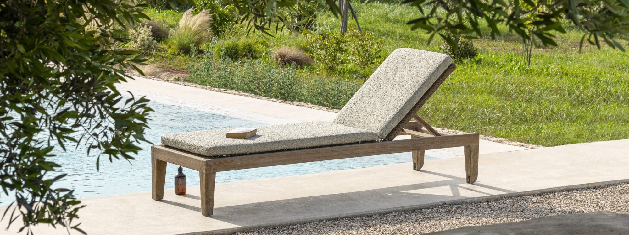 Image of Gommaire Lisa sunlounger with wheels on sunny Mediterranean poolside