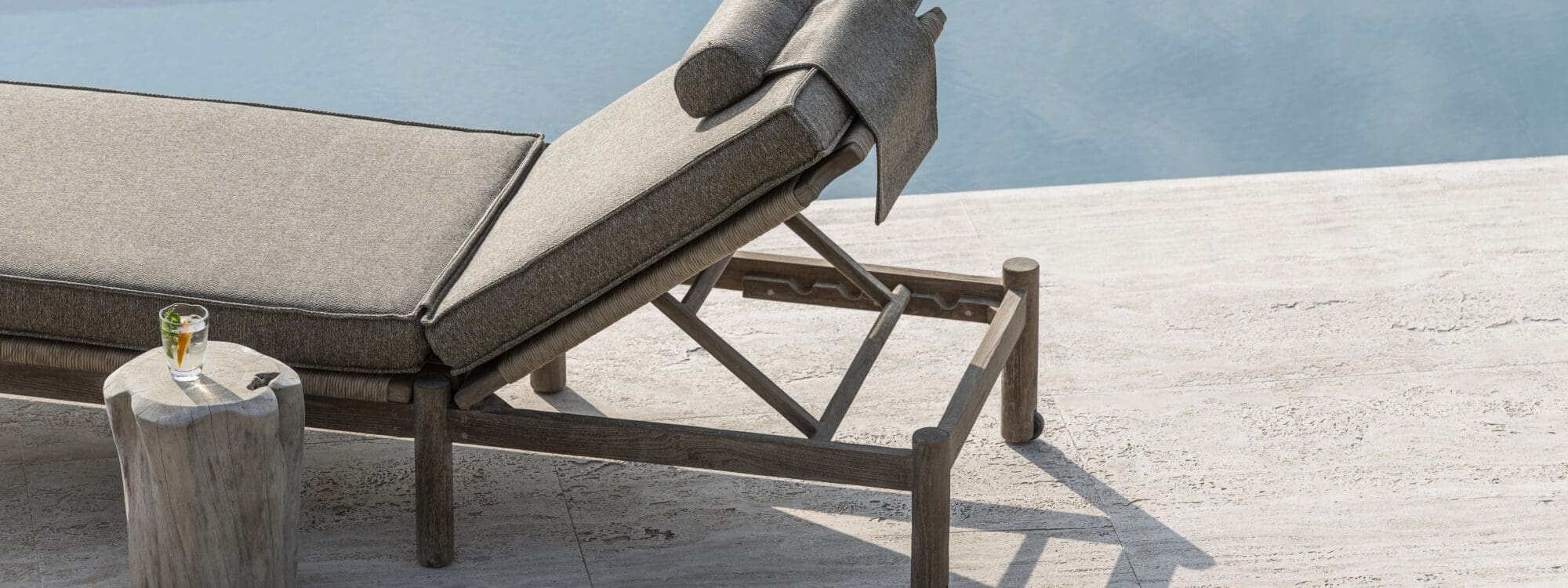 Image of Gommaire Mieke teak sunlounger with cushion on sunny poolside