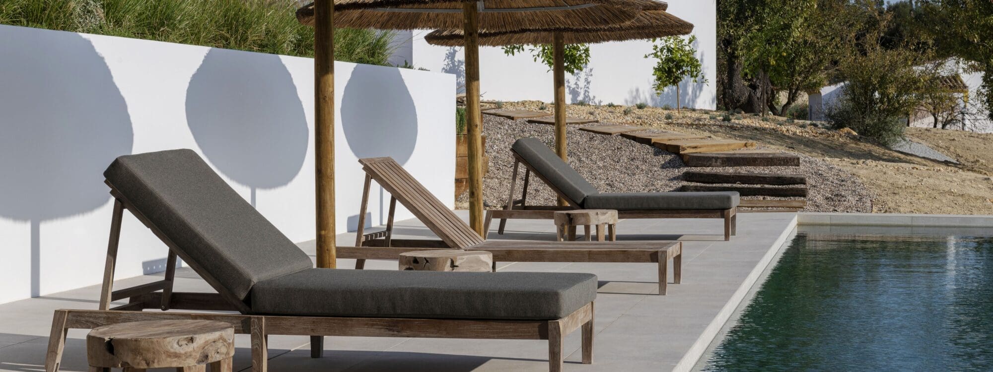 Image of Gommaire Copenhague Sunny teak daybeds along sunny poolside