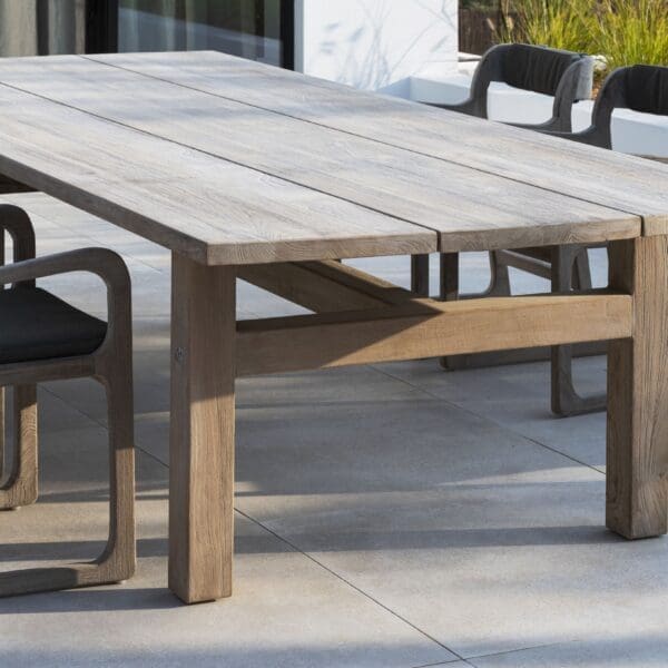 Image of Gommaire Abe large rectangular teak dining table and Sally teak garden dining chairrs