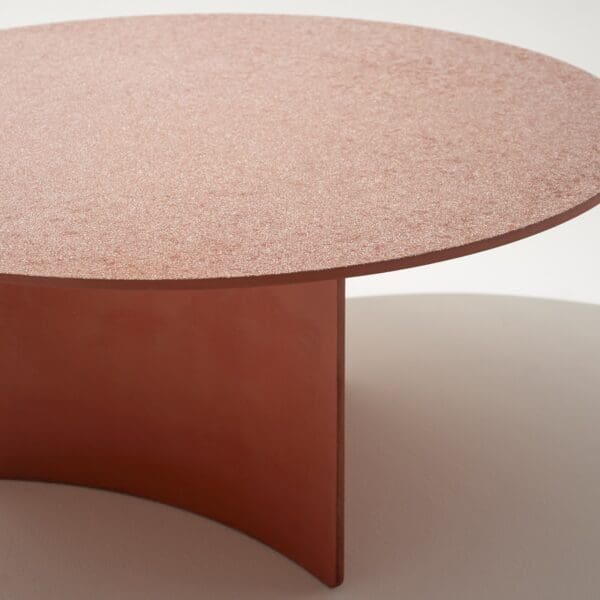 Image of Roda Aspic circular garden table in poured orange concrete
