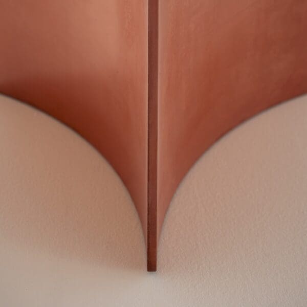 Studio image of curved concrete base of Aspic modern table by RODA