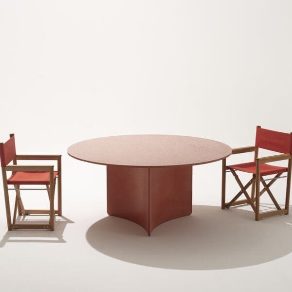 Studio image of RODA Aspic geometric garden dining table with Orson director chairs