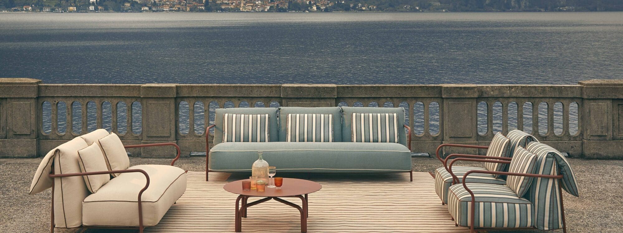 Image of Salo modern garden sofa set by Unopiu with Italian lake in the background