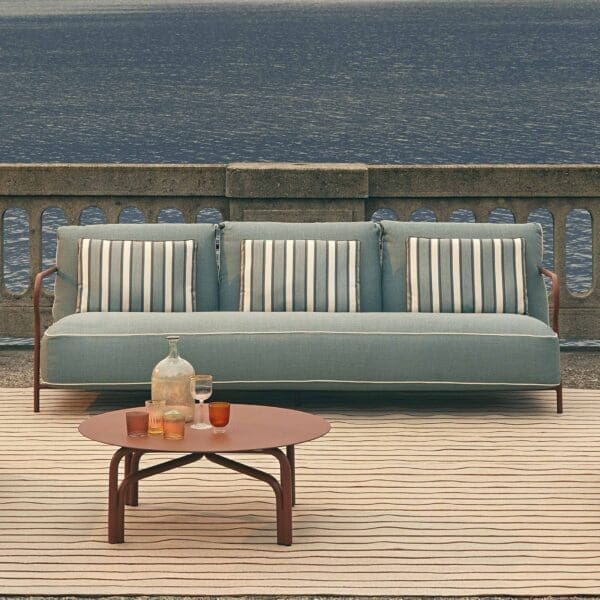 Image of Salo modern garden sofa by Unopiu with Italian lake in the background
