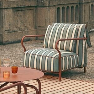 Image of Salo exterior lounge chair with terracotta frame and striped upholstery by Unopiu