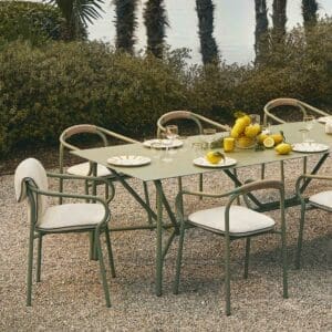 Image of Unopiu Salo chair and Salo table on terrace overlooking palm trees and lake