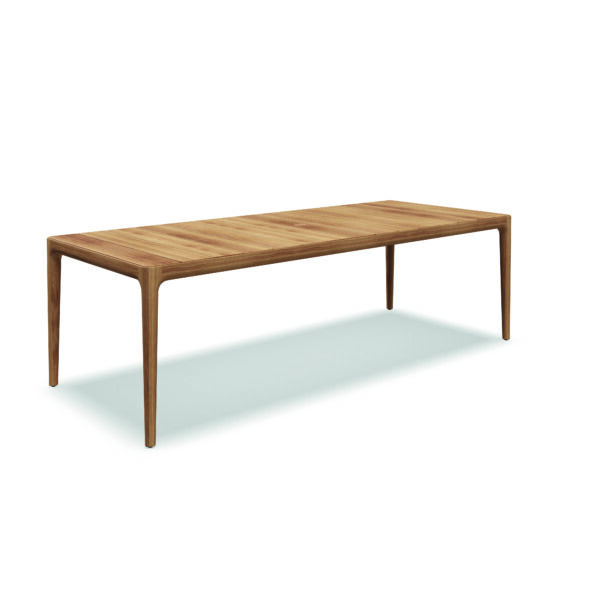 Studio image of large Gloster Lima teak garden dining table