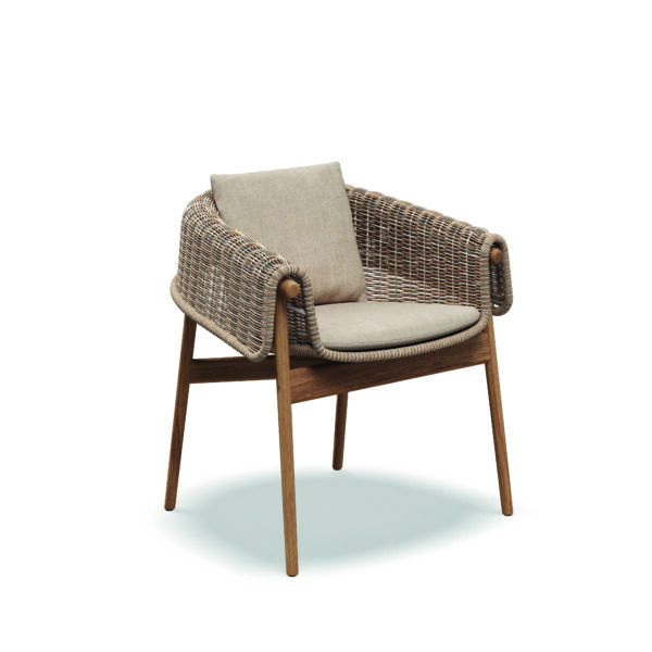 Studio image of Gloster Wrap luxury garden chair in Sorrel wicker and teak