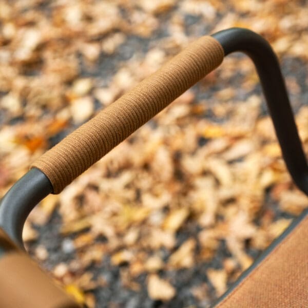 Image of detail of the acrylic cord bound arms of Eric modern garden chair