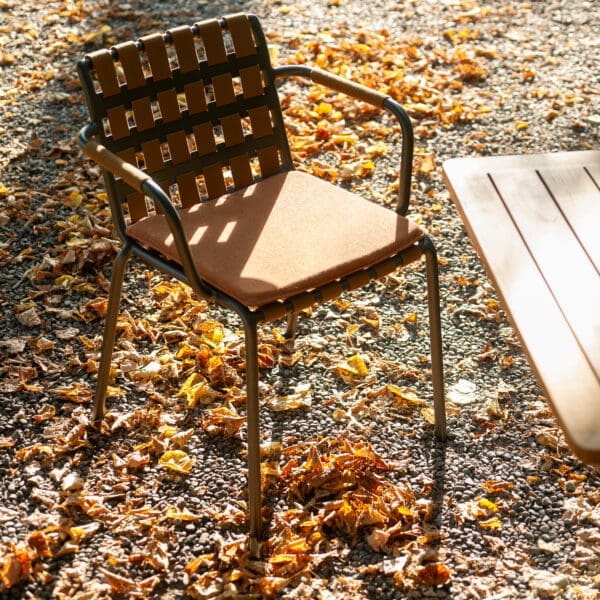 Image of Roda Erice garden chair amid Autumn leaves