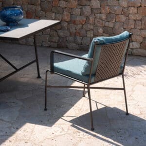 Image of Stresa garden dining tabvle and chair in sunshine and shadows