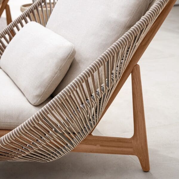 Image of detail of Gloster Bora lounger's sorrel wicker and teak construction
