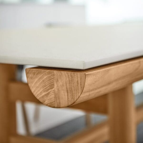 Image of detail of Gloster Rail dining table's teak frame