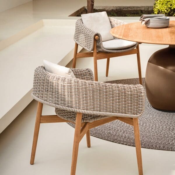 Image of pair of Gloster Wrap garden chairs and Kasha garden dining table