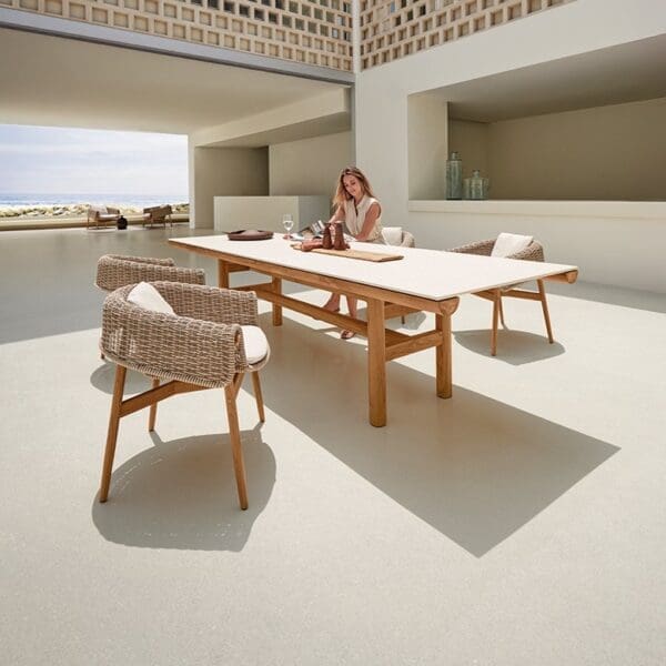 Image of Gloster Wrap garden chairs and Rail dining table