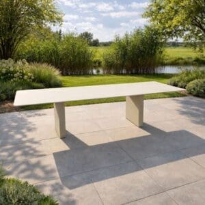 Image of Doble Slim minimalist garden tabvle with verdant garden in the background