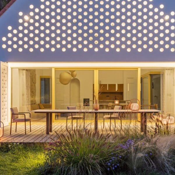 Image at nighttime of Todus Kori Flex XL garden dining table