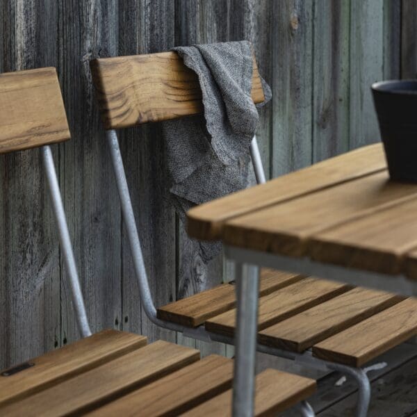 Image of detail of Chair 1 teak slats and hot galv frame by Grythyttan Stahlmobler