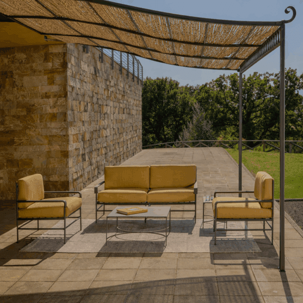 Image of Unopiu Toscana lounge furniture beneath pergola in blazing Italian sunshine