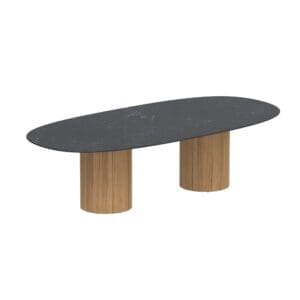 Studio image of Royal Botania Regaliz super ellipse garden dining table with round teak pedestal bases and ceramic table top