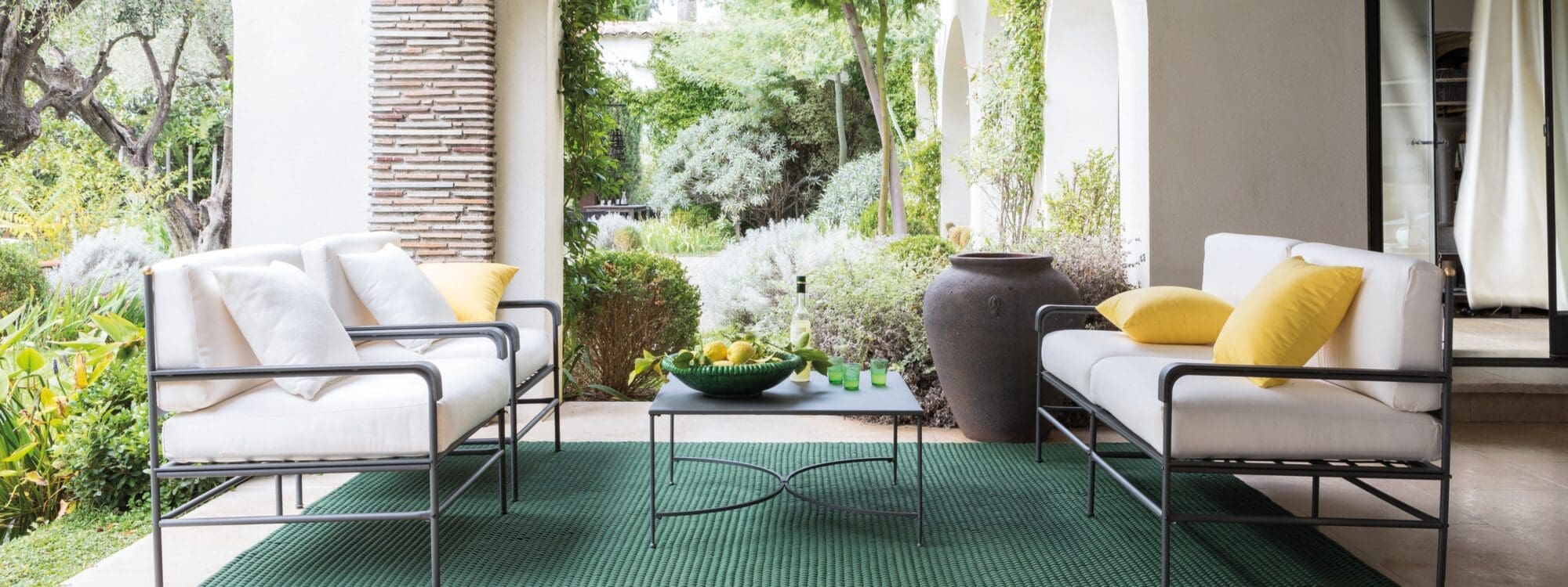 Ambient image of Unopiu Toscana classic steel garden sofa and lounge chairs