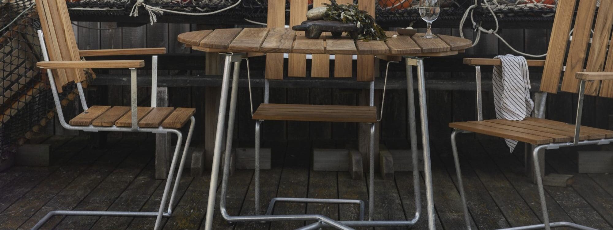 Image of Grythyttan Stahlmobler armchair A2 and Classic round teak table