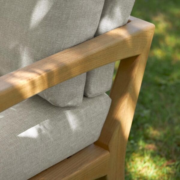 Image of detail of Royal Botania Zenhit Lounge teak sofa's arm and luxurious outdoor upholstery