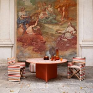 Image of RODA Orson chairs in Missoni fabrics together with Aspic table in orange concrete