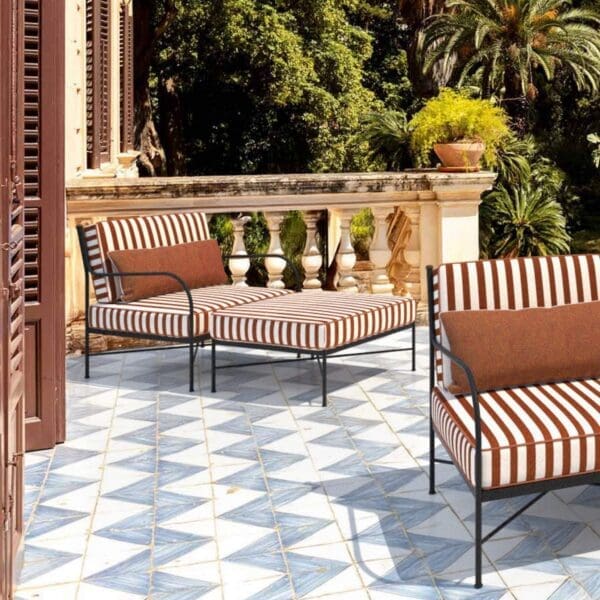 Image of Unopiu Igea lounge furniture with striped cushions in the sunshine