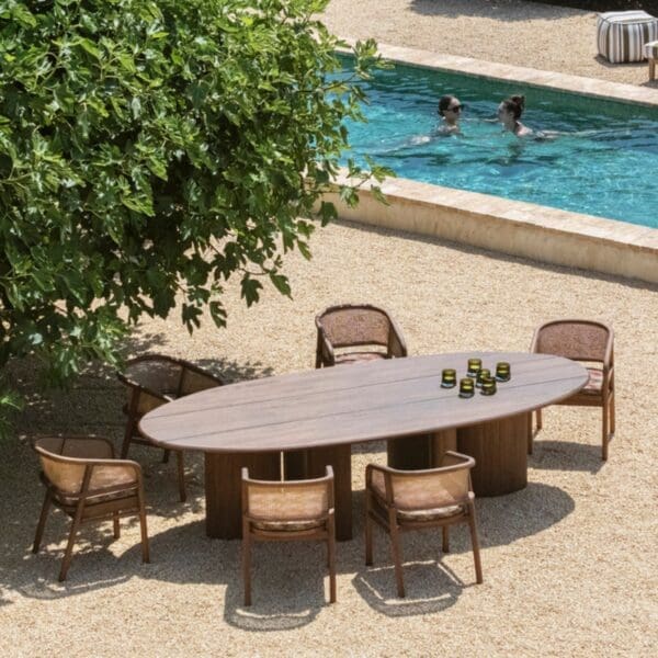 Birdseye view of Gommaire Gommaire Imen Oval Table in and Imen chairs in Emas brown stained teak
